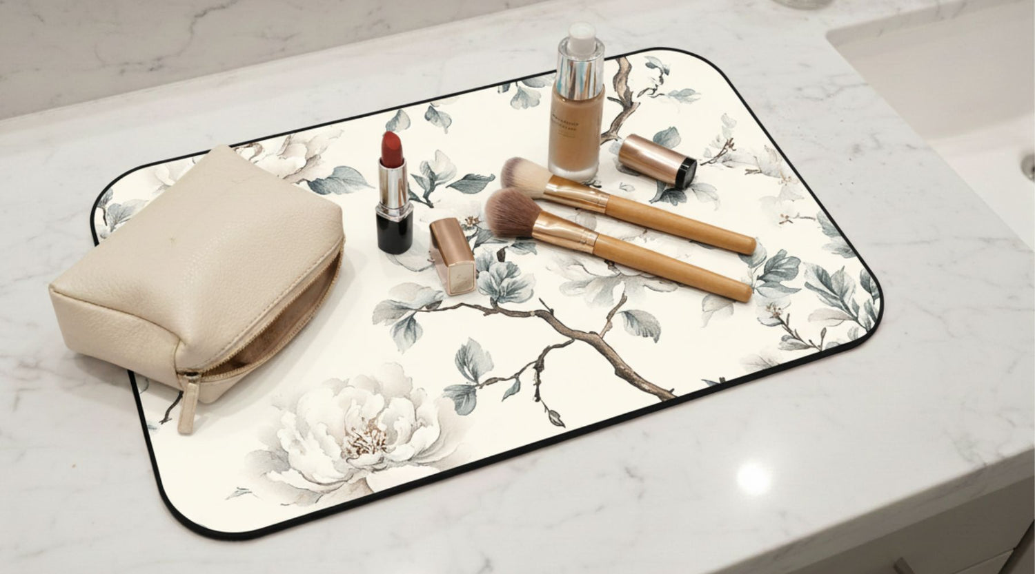 Makeup mat with floral design protects vanity surfaces from makeup spills, stains, and powder mess